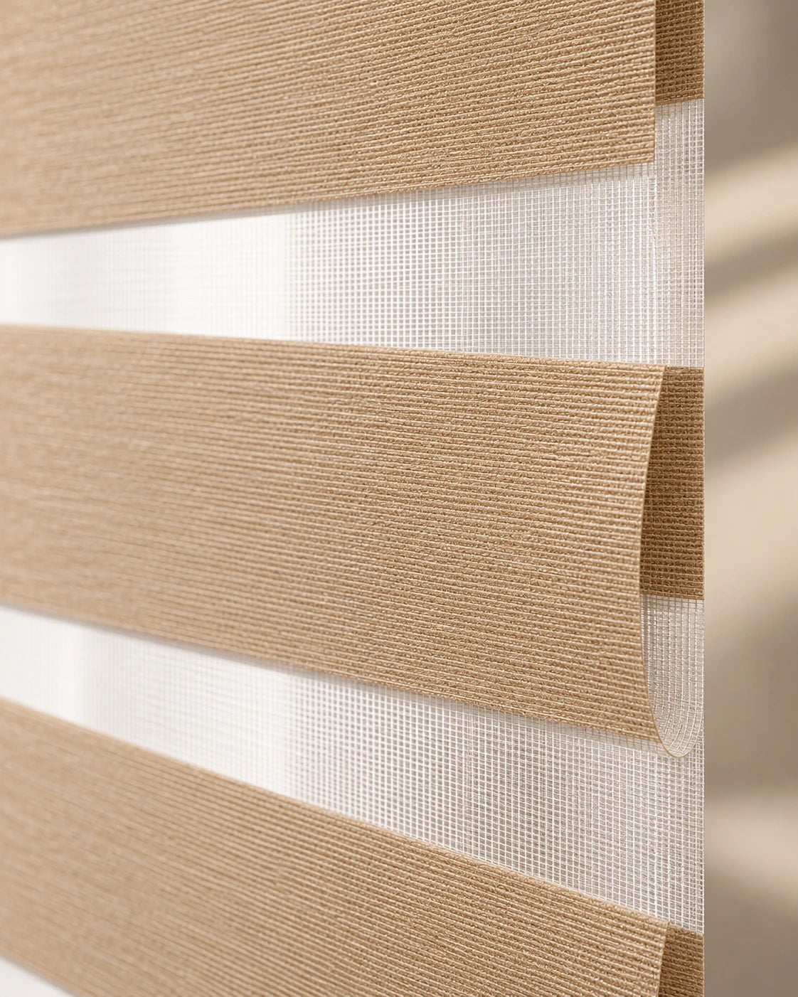 Light-filtering zebra shade · Sheer and woven fabric bands
